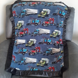 Semi Trucks, Crib Fleece blanket with a matching navy blue  satin trim