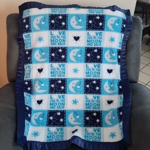 Infant Crib Fleece blanket - &quot;Love you to the moon and back&quot; with matching navy blue satin edging.