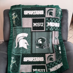 Michigan State University, Infant Receiving Crib Fleece Blanket with a green satin trim