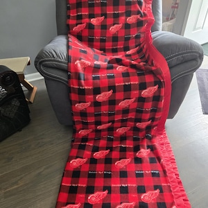 NHL Detroit Red Wings, Adult XL Big/Tall Fleece Blanket with a red satin trim