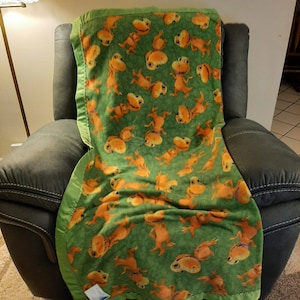Lively Buddy Rex, the Young Tyrannosaurus Mascot, Kids Fleece Blanket with a lime green satin edging