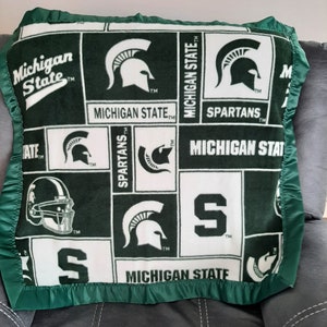 Michigan State University, Infant Receiving Fleece Blanket with a green satin trim