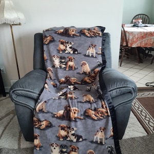Multiple breed dogs, teen/adult pet fleece blanket with a black satin trim