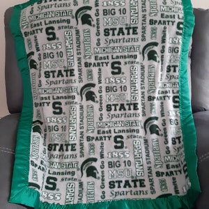 Michigan State University, Infant Crib Fleece Blanket with a green or gray satin trim