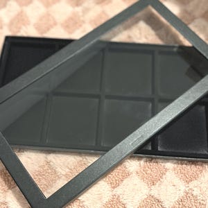 Vetrina/teca nera con piano in vetro per decorazioni natalizie Swarovski