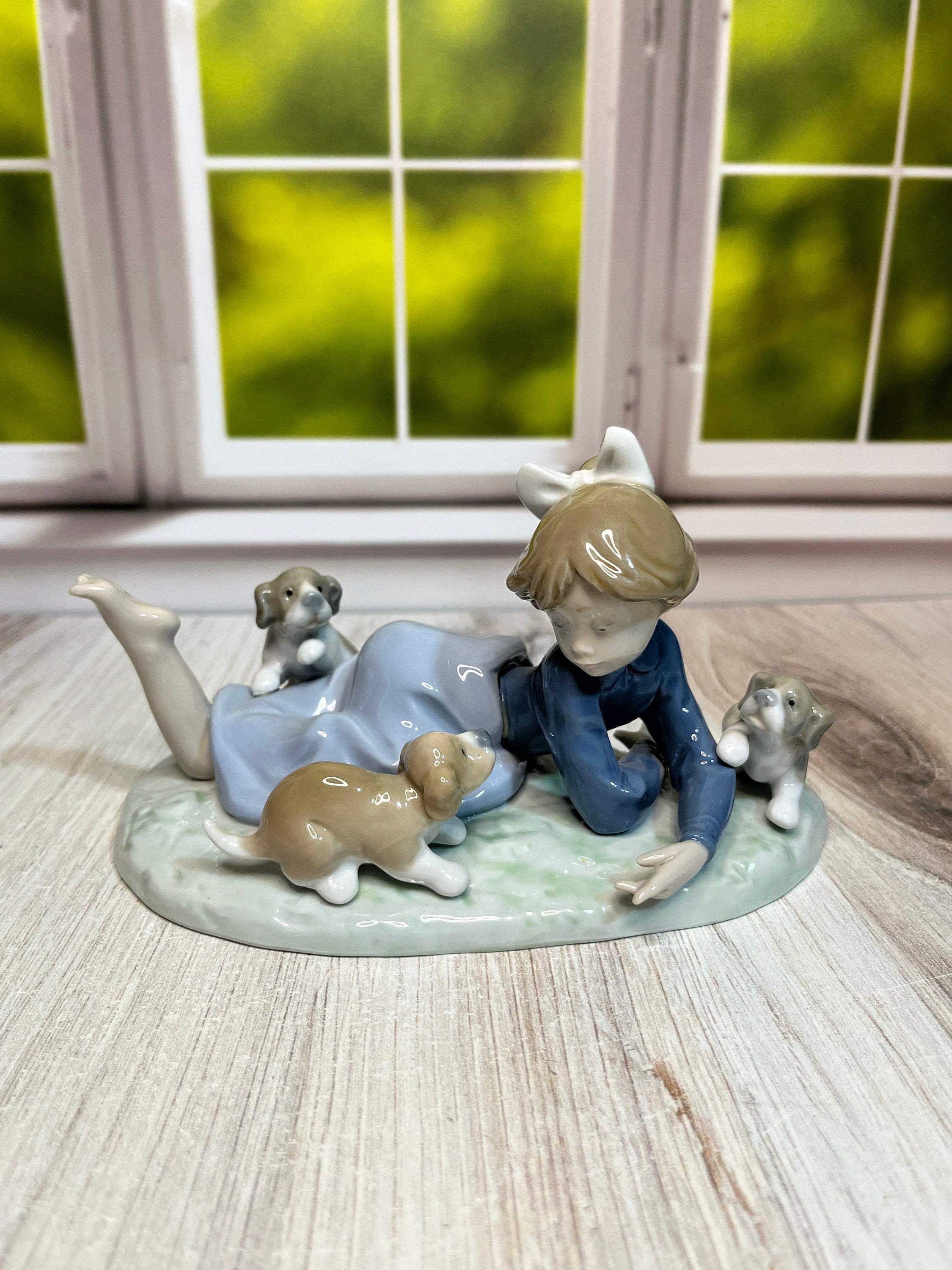 LLADRO A ROMP IN THE GARDEN