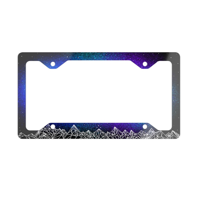 May include: A black license plate frame with a galaxy design and white geometric mountain silhouette.