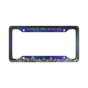 May include: Black license plate frame with a blue, purple, and green gradient. The text "HOUSE OF WIND BOOK CLUB" is at the top. A white mountain range design is at the bottom.