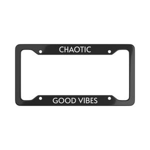 May include: A black license plate frame with the words "CHAOTIC" at the top and "GOOD VIBES" at the bottom in white lettering. The frame has a rectangular shape with rounded corners.