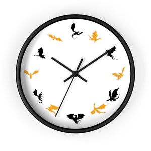 May include: A black and white clock with a white face and black hands. The clock has a black frame and a white background. The clock face has 12 black dragon silhouettes around the edge, with 6 gold dragon silhouettes.