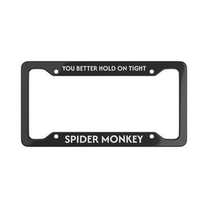 May include: Black license plate frame with the text "YOU BETTER HOLD ON TIGHT" at the top and "SPIDER MONKEY" at the bottom in white lettering. The frame has a rectangular shape.