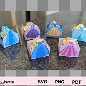 May include: Six cupcake wrappers featuring different princess characters. Each wrapper is a different color and has a different princess design. The wrappers are made of cardstock and are perfect for decorating cupcakes for a princess-themed party.