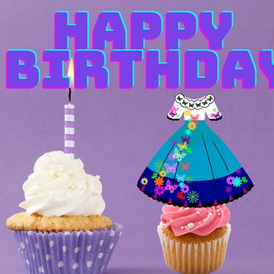 May include: Two cupcakes decorated for a birthday. One cupcake has a white frosting with a lit candle and a purple and white striped candle. The other cupcake has pink frosting and a blue and white dress with butterflies and flowers on top. The background is purple. The text "Happy Birthday" is in purple with a blue outline.