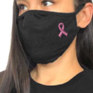May include: Black face mask with a pink ribbon embroidered on the front. The ribbon is a symbol of breast cancer awareness.