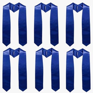 May include: Six royal blue graduation stoles. Each satin stole features a V-neck design and a pointed bottom. The stoles are arranged in a grid against a white background, emphasizing their vibrant colour and smooth texture.