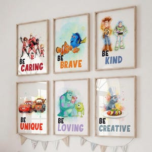 May include: Six framed art prints with Disney characters and inspirational messages. The prints feature characters from "The Incredibles," "Finding Nemo," "Toy Story," "Cars," "Monsters, Inc.," and "Ratatouille." Each print has a different message: "Be Caring," "Be Brave," "Be Kind," "Be Unique," "Be Loving," and "Be Creative."