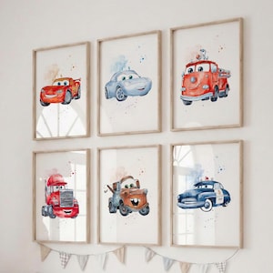 May include: Six framed watercolor prints of cartoon cars in a child's room. The cars are red, blue, and orange, with a fire truck, police car, and tow truck. Each print has a light brown frame and a watercolor splash background.