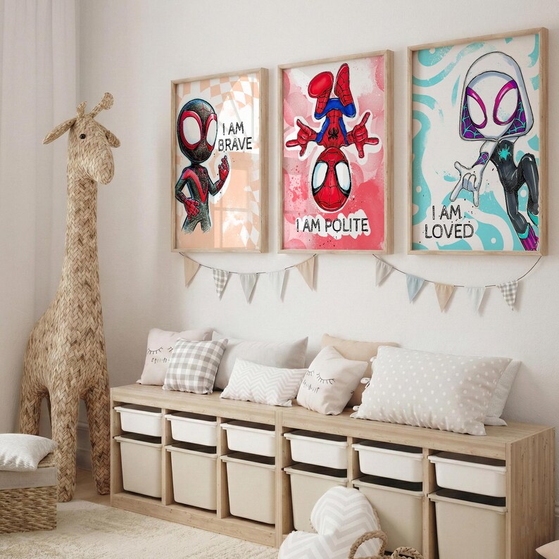 May include: Three framed superhero art prints with the phrases "I AM BRAVE", "I AM POLITE", and "I AM LOVED". The artwork features illustrations of Spider-Man characters in a child's bedroom setting. A large giraffe toy and storage unit are also visible.