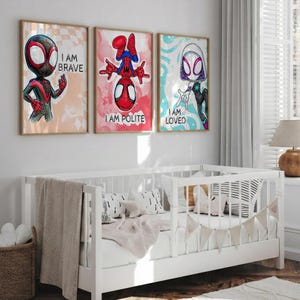 May include: Three framed art prints featuring Spider-Man characters. Each print has a different character with the phrases "I AM BRAVE", "I AM POLITE", and "I AM LOVED". The artwork has a watercolor style with vibrant colors and a wooden frame.