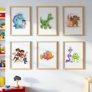 May include: Six framed art prints featuring colorful cartoon characters. The prints include characters from popular animated movies, such as a blue monster with a girl, a green dinosaur, and a clownfish. The frames are made of light-colored wood.