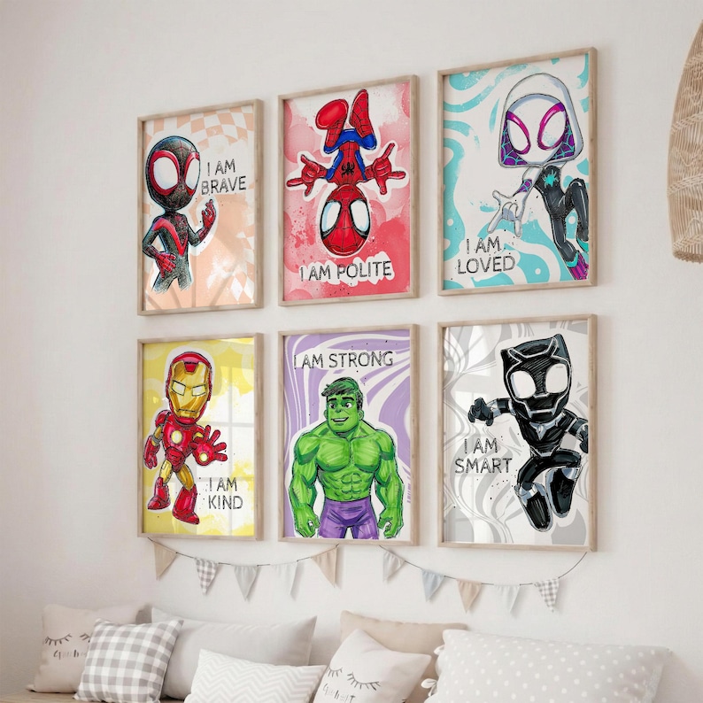 May include: Six framed superhero art prints. Each print features a different character with a motivational phrase: "I AM BRAVE", "I AM POLITE", "I AM LOVED", "I AM KIND", "I AM STRONG", and "I AM SMART". The prints have a light wood frame.