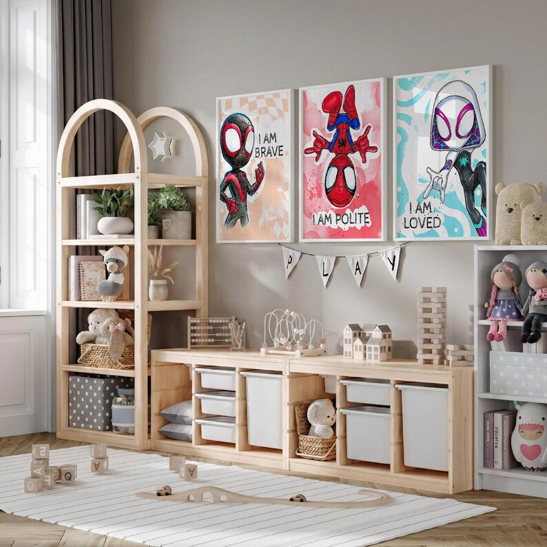 May include: A light wood children's room set with a bookshelf, storage unit, and three framed Spider-Man art prints. The prints read "I AM BRAVE", "I AM POLITE", and "I AM LOVED". The room is decorated with toys, plants, and a striped rug.