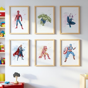 May include: Six framed watercolour prints showcasing Marvel superheroes: Spider-Man, Hulk, Spider-Gwen, Thor, Iron Man, and Captain America. Each character is in action poses with colourful watercolour splashes, in a light wood frame.