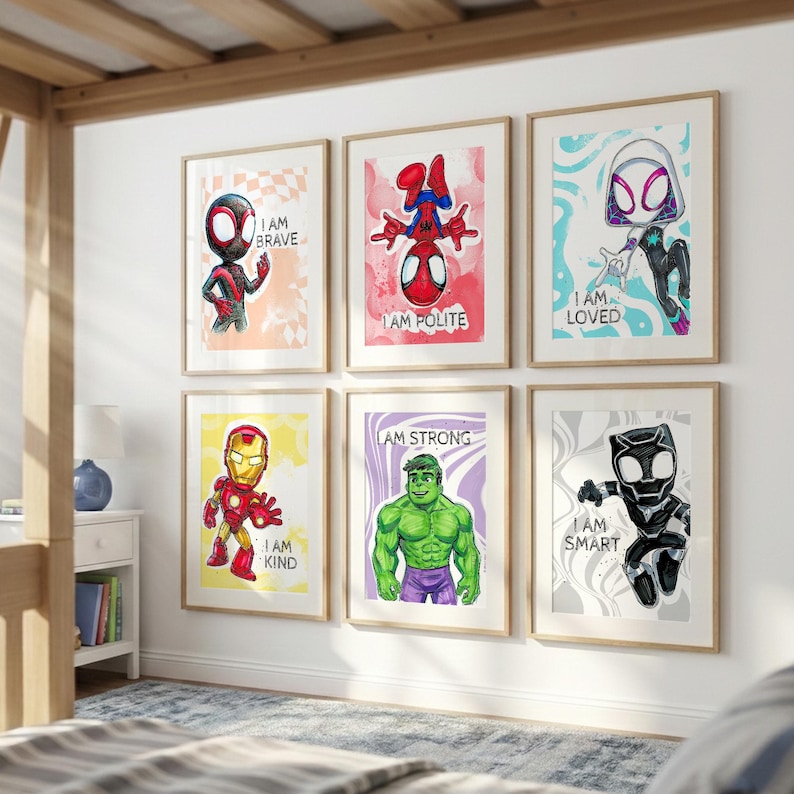 May include: Six framed art prints featuring superhero characters. Each print has a cartoon illustration of a character with a positive affirmation. The characters include Spider-Man, Iron Man, and Hulk. The prints are in a child's bedroom.