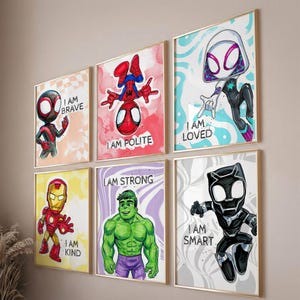May include: Six framed superhero art prints. Each print features a different character: Miles Morales, Spider-Man, Spider-Gwen, Iron Man, Hulk, and Black Panther. Each print has a motivational phrase: "I am Brave", "I am Polite", "I am Loved", "I am Kind", "I am Strong", and "I am Smart".