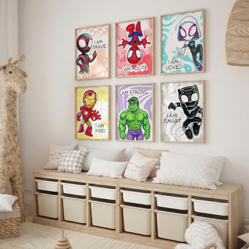 May include: Six framed superhero art prints with the phrases "I AM BRAVE", "I AM POLITE", "I AM LOVED", "I AM KIND", "I AM STRONG", and "I AM SMART". The prints are displayed above a wooden storage unit with white bins.