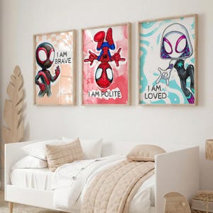 May include: Three framed superhero art prints. The prints feature Spider-Man characters with the phrases "I AM BRAVE", "I AM POLITE", and "I AM LOVED". The artwork has a watercolor style with a light wood frame.