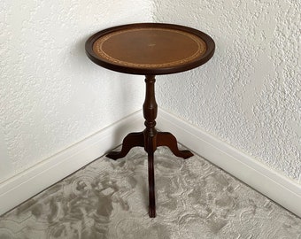 Small vintage French wine table with brown leather top, Small round table on a Victorian turned wood base,