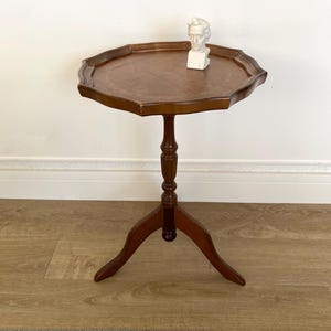 Small vintage French wine table with brown leather top, Small round table on a Victorian turned wood base,