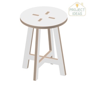 May include: White wooden stool with a round seat and four legs. The seat has a cross-shaped cutout.
