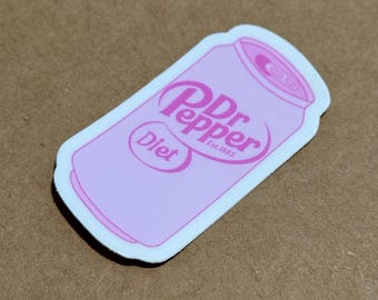May include: A pink and white sticker of a can of Diet Dr Pepper. The can is pink with white text that says "Dr Pepper Est. 1885" and "Diet".