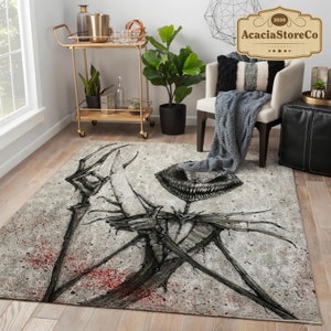 May include: A rectangular area rug with a dark, skeletal illustration on a light gray background. The artwork features a grinning skull and a stylized figure with outstretched arms, with red splatter accents.