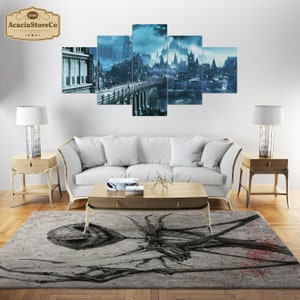 May include: A living room setup featuring a five-panel wall art depicting a fantasy city in shades of blue and gray. The room includes a white sofa, wooden side tables with lamps, a coffee table, and a patterned rug with a dark, abstract design.