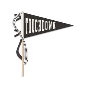 May include: A black pennant flag with the word "TOUCHDOWN" in white block letters. The flag is triangular and attached to a wooden dowel. White and black ribbons are attached to the flag.
