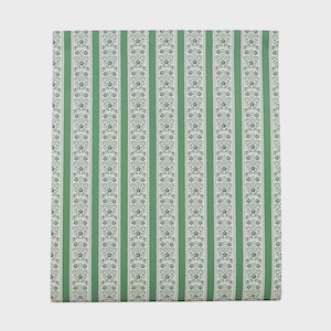 May include: A fabric textile featuring a repeating pattern of vertical stripes in solid green alternating with white bands. The white bands are decorated with a delicate, dark green floral vine motif and scalloped edges on both sides.