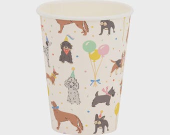 May include: A cream-colored paper cup featuring a repeating pattern of various dog breeds wearing colorful party hats. The design includes illustrations of dogs in shades of brown, gray, and black, interspersed with colorful balloons and confetti.
