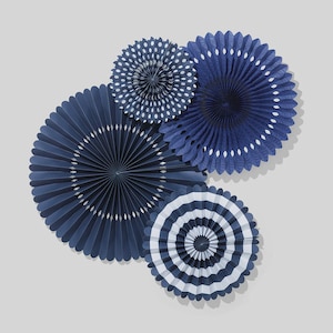 May include: An assortment of navy blue paper fans in various sizes and patterns. Some fans have white polka dots or scalloped edges, while others feature concentric stripes. These decorative fans are ideal for parties and events.