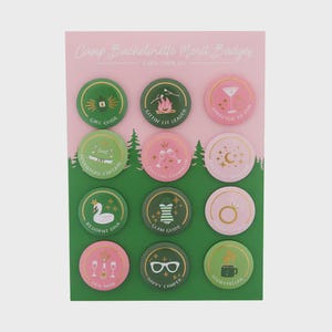 May include: A sheet of Camp Bachelorette Merit Badges with various designs. The badges are round and feature illustrations and text like "Girl Guide," "Gettin Lit Leader," and "Director of Fun." The color scheme includes green, pink, and gold accents.