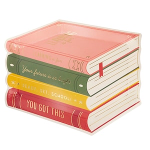 May include: A stack of four book-shaped paper plates. The top plate is pink with the words "LEARNING is fun". The other plates are green, yellow, and red, with the phrases "Your future is so bright", "READY. SET. SCHOOL!", and "YOU GOT THIS".