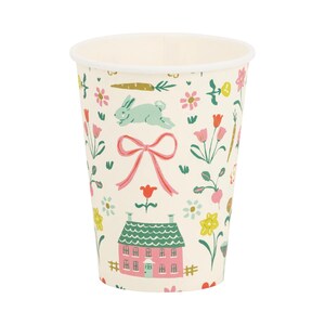 May include: A set of paper cups with a whimsical spring-themed design. The cups feature a pink house, a green bunny, flowers, and a pink bow.