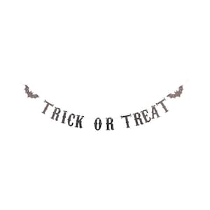 TRICK OR TREAT vintage paper letter banner with a bat on each end, shown strung out flat.