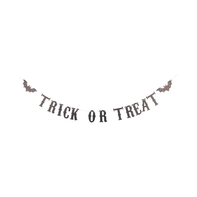 TRICK OR TREAT vintage paper letter banner with a bat on each end, shown strung out flat.