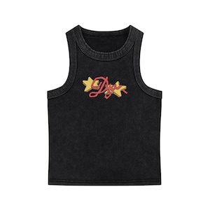 May include: Black ribbed tank top with the word "Dior" in pink script and yellow star accents. The tank top has a vintage, washed appearance.
