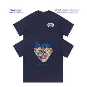 May include: A navy blue short-sleeve t-shirt featuring a small oval logo on the front with the text DJO in yellow and blue. The back displays a graphic of a billiard ball rack with the text DJO Decide and Time To Decide in blue.