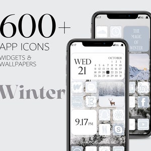 May include: A phone screen with a winter themed app icon set. The icons are white with a gray outline and are arranged in a grid pattern. The phone screen also includes a calendar widget with the date October 21st highlighted. The background is a snowy forest scene.