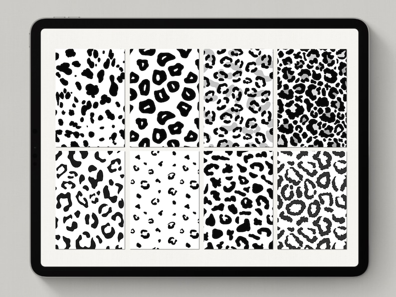 May include: A digital tablet screen displaying eight different black and white leopard print patterns.